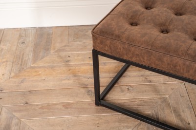 brown footstool with metal legs